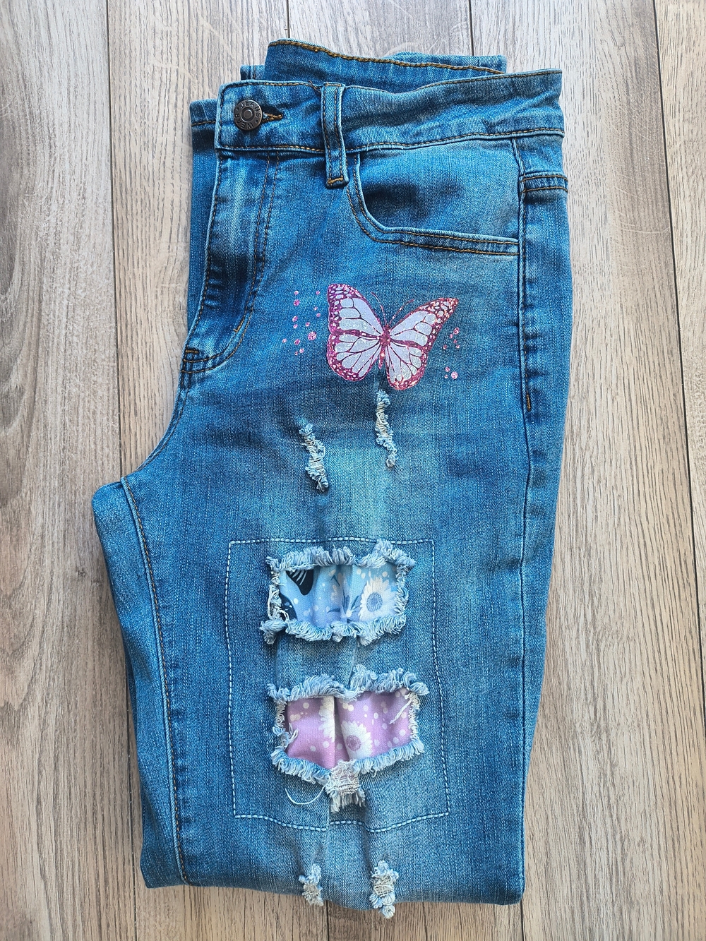 Skinny Distressed Blue Denim Jeans with Pink Butterfly Accent